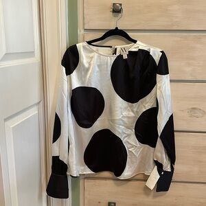 Black and white with large cuffs. Fun blouse